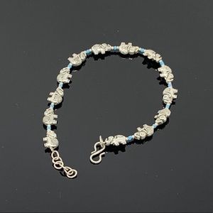 Sliver colored elephant anklet.